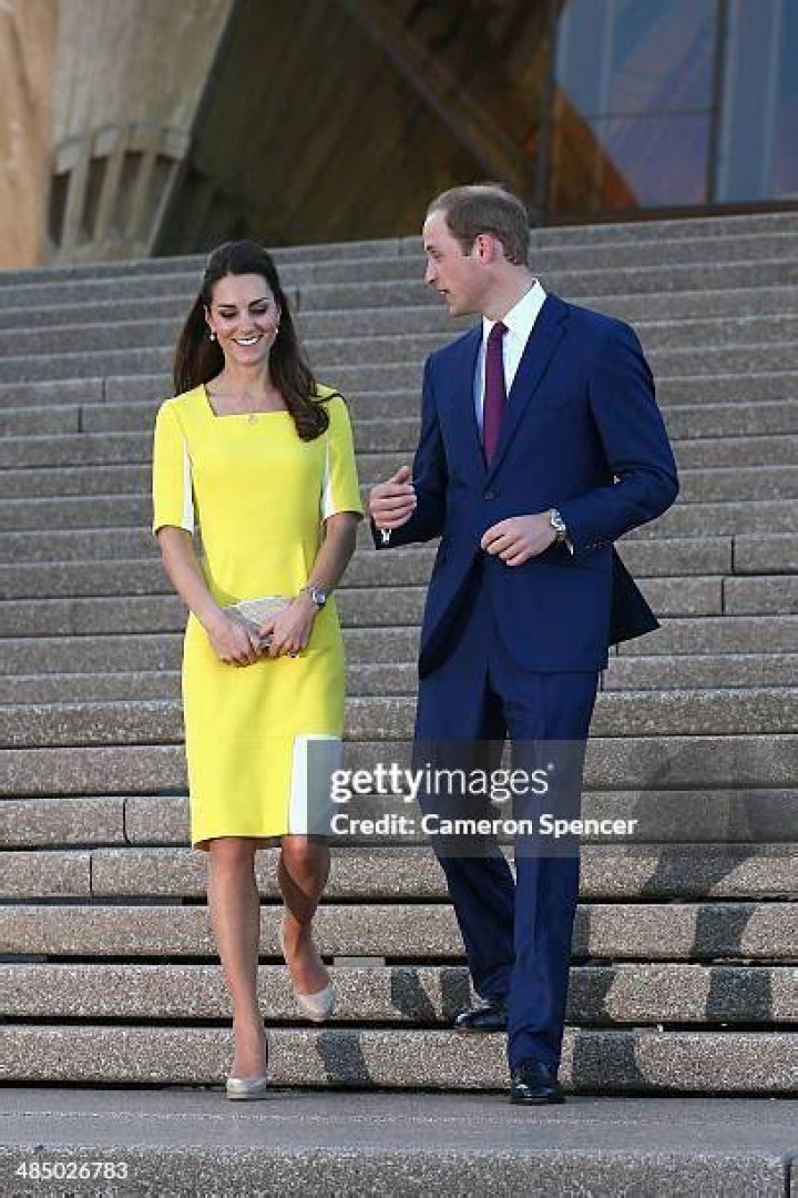 Kate Middleton walks down stairs with Prince George